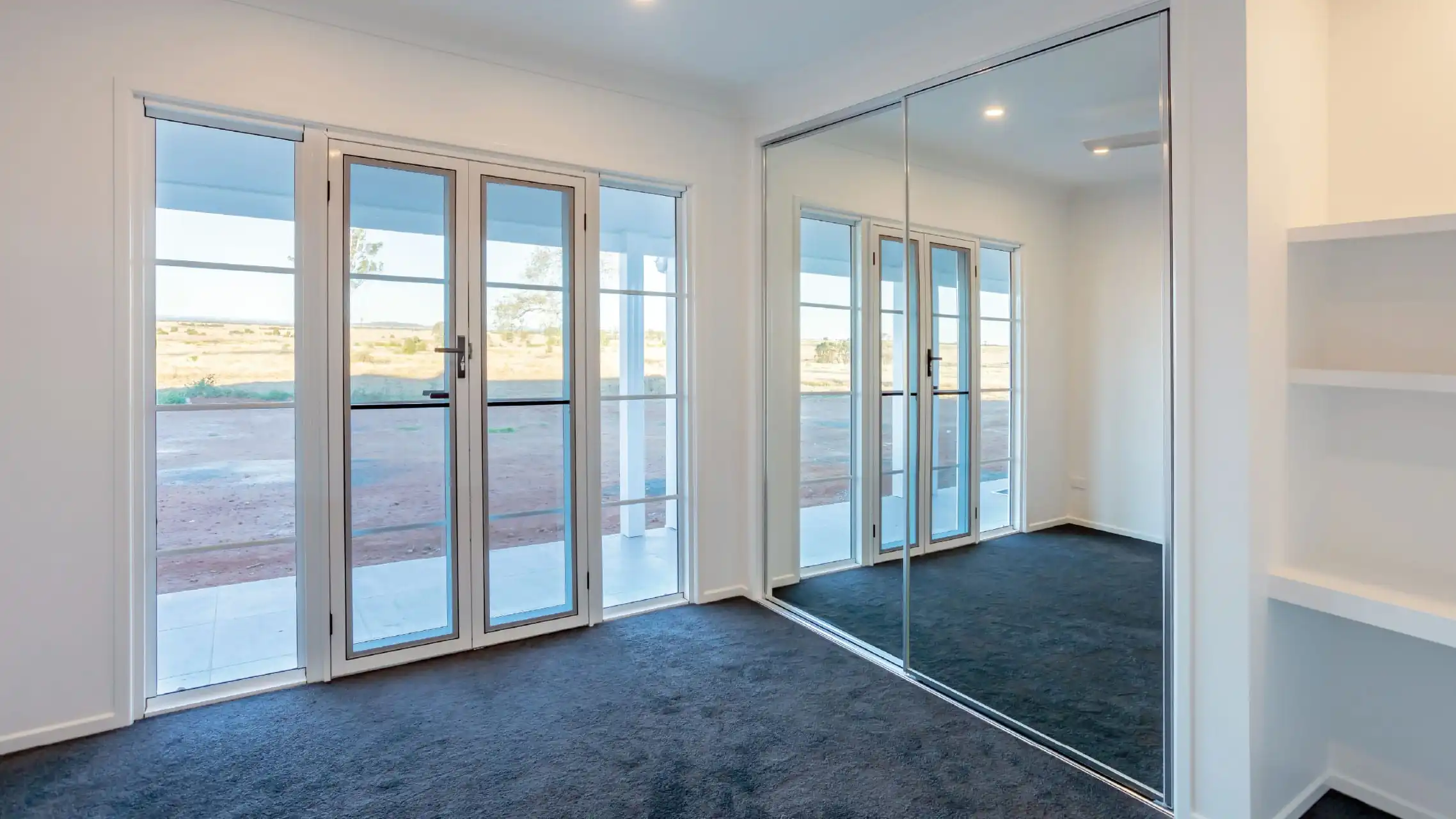 Mirror Sliding Wardrobe Doors in a bedroom