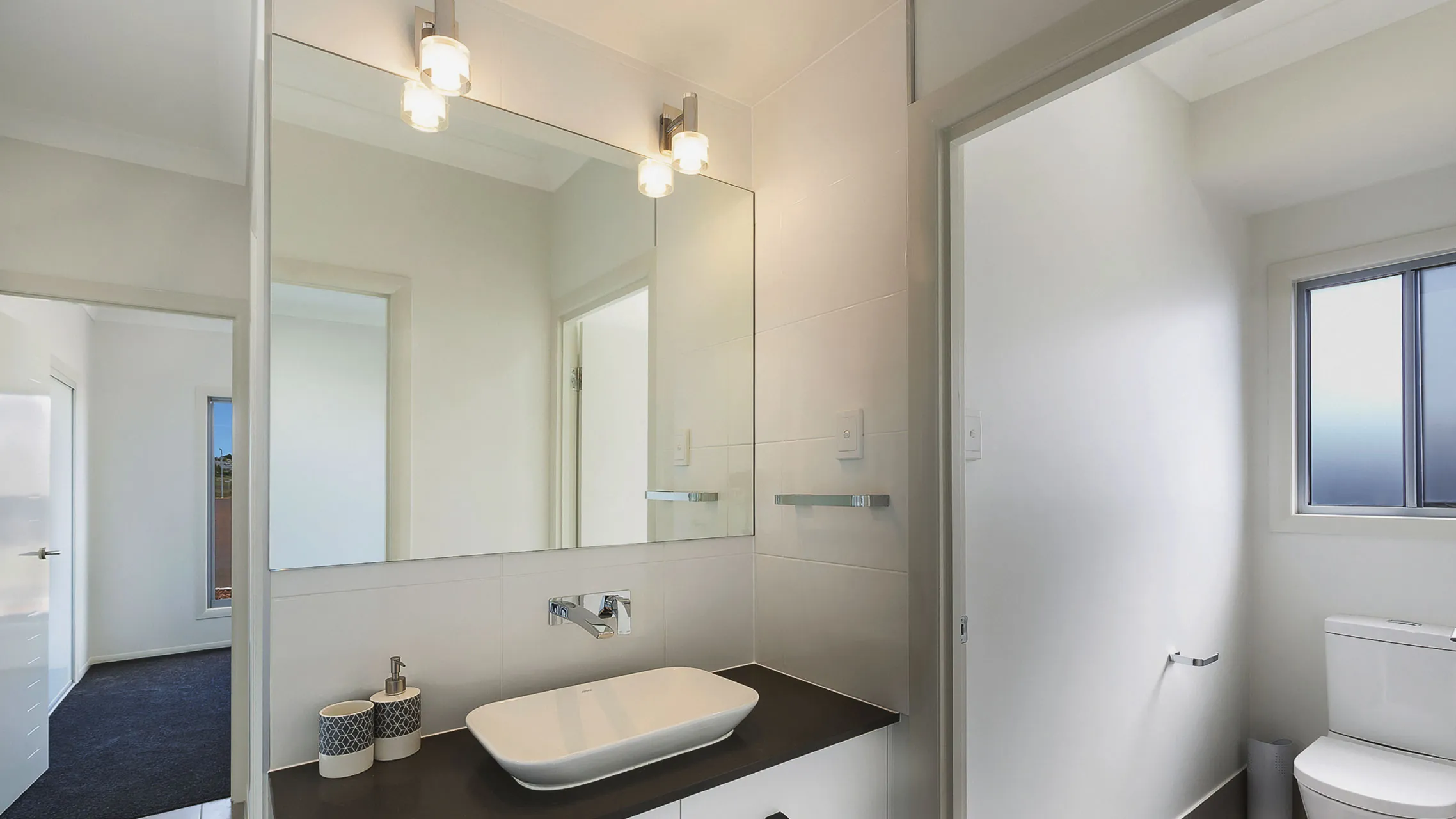 Frameless Bathroom Mirror with two light fittings above it