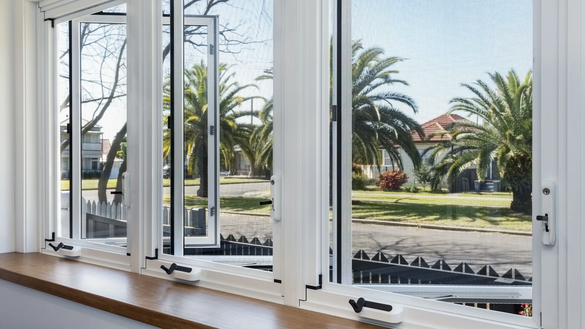 White Casement Windows above a bench